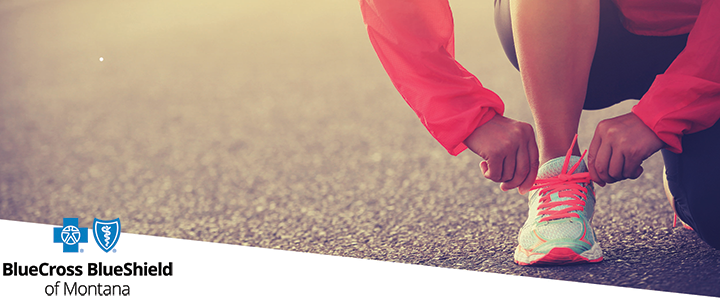 an image tying shoes with BCBSMT logo